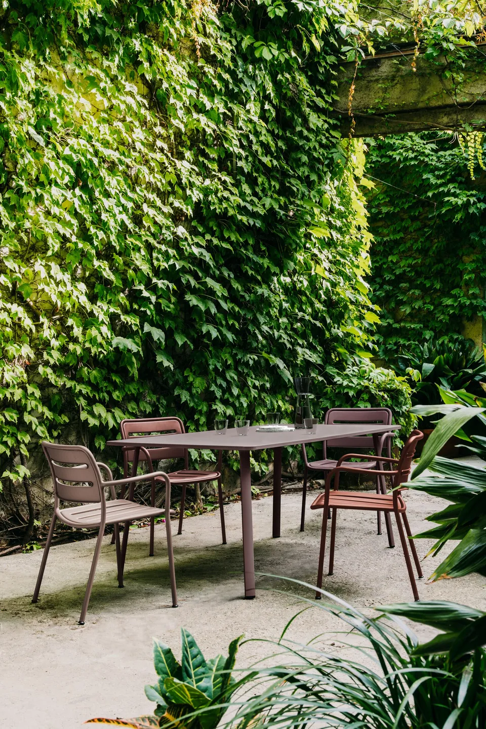 Kettal Village outdoor furniture in use, catalog photograph